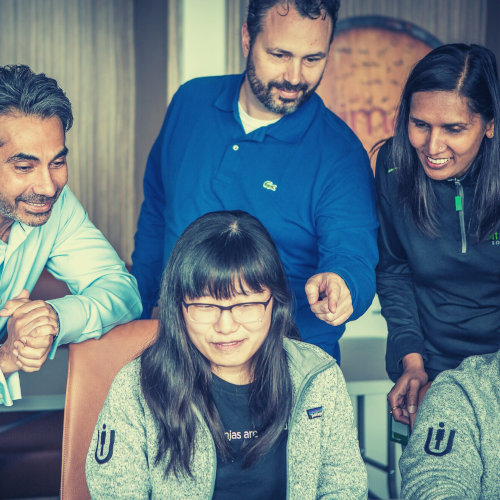 Team or coworkers watching a laptop